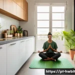Home 21 습관 스택킹 기법으로 시간 관리 개선하기 - A cozy, sunlit morning scene in a modern Brazilian apartment kitchen featuring a young adult meditat...